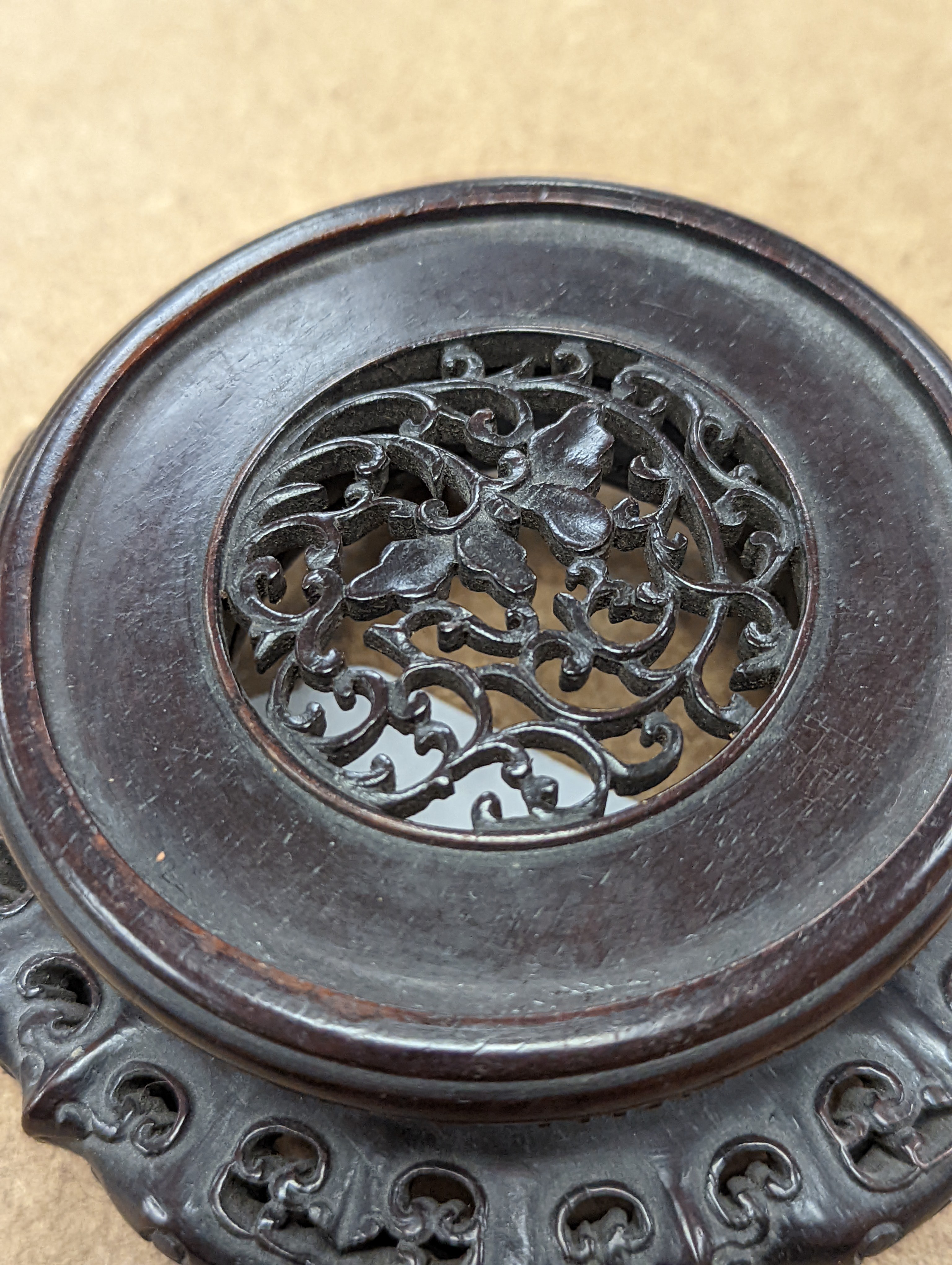 A fine 19th century Chinese hardwood stand, 11.4cm diameter